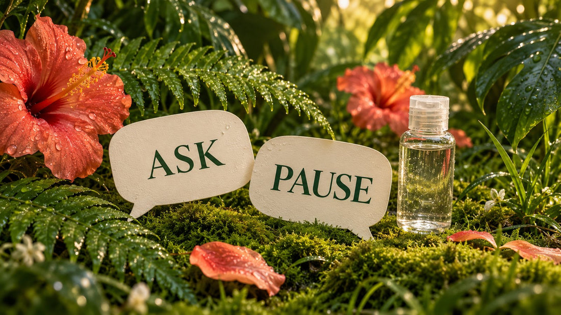 Two paper speech cards marked Ask and Pause beside a generic unbranded bottle among dew-covered ferns and flowers.